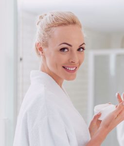 Young woman taking care of her skin