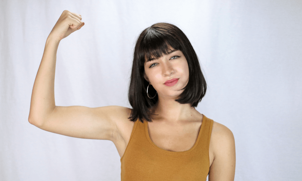 Woman showing off her arm muscles